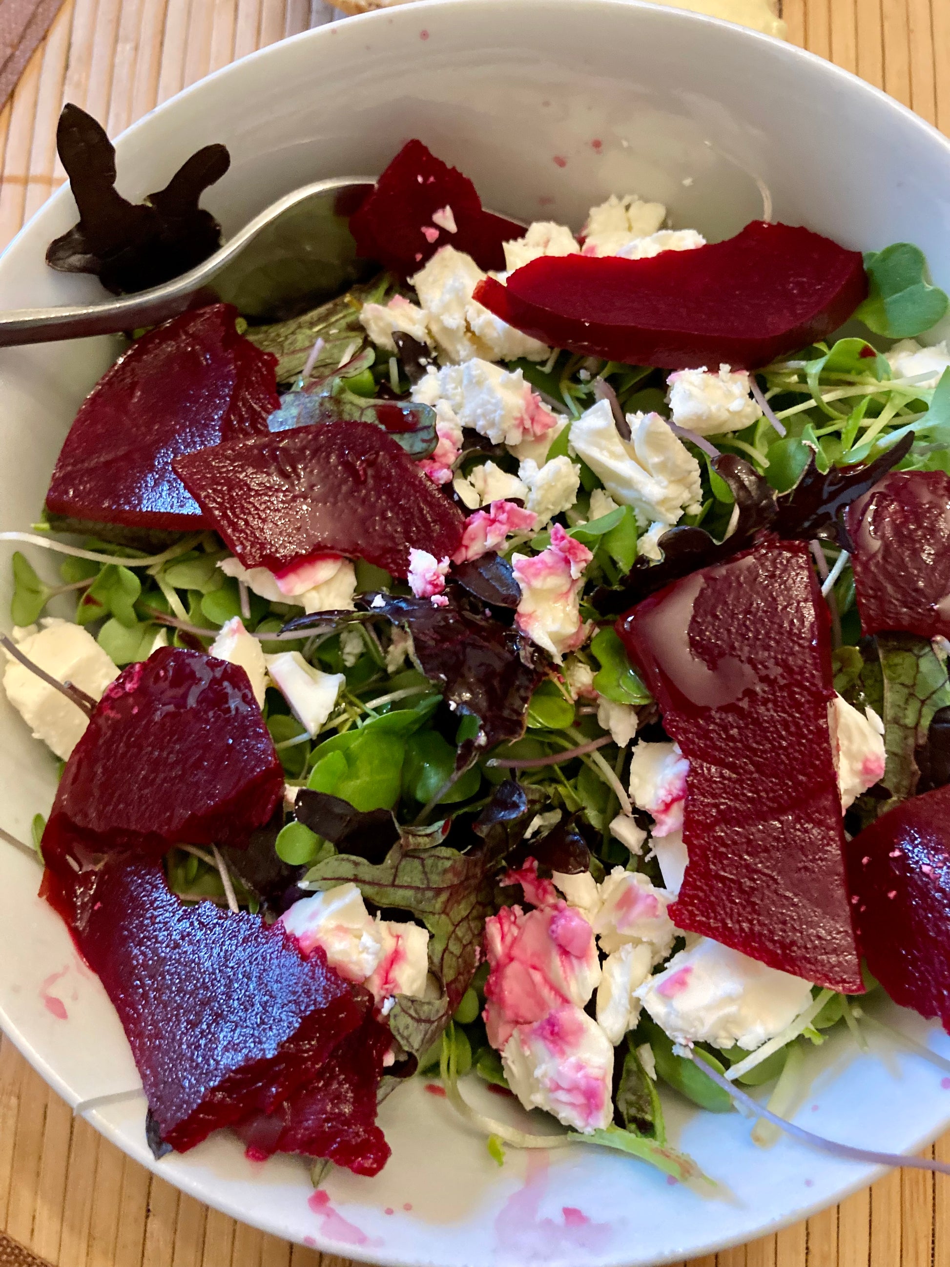 Fed Up Foods Kickin Pickled Beet on a salad with goat cheese and lettuce and balsamic vinegar