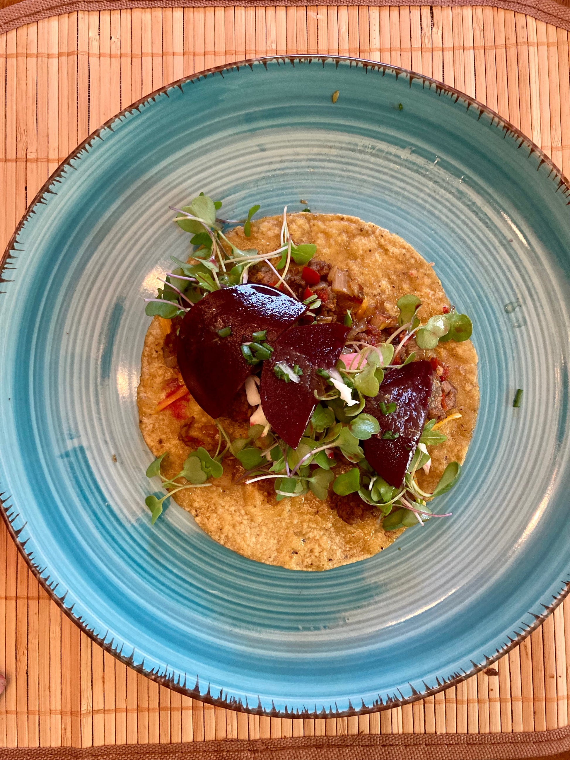 Fed Up Foods Kickin Pickled Beet on a taco with ground beef microgreens and a corn tortilla